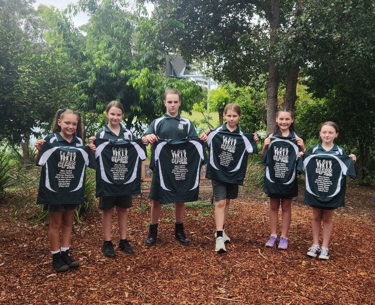 six Year 6 students presented with their year 6 shirts