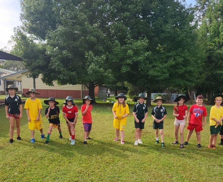 a mixed group of junior students on the starting line at cross country