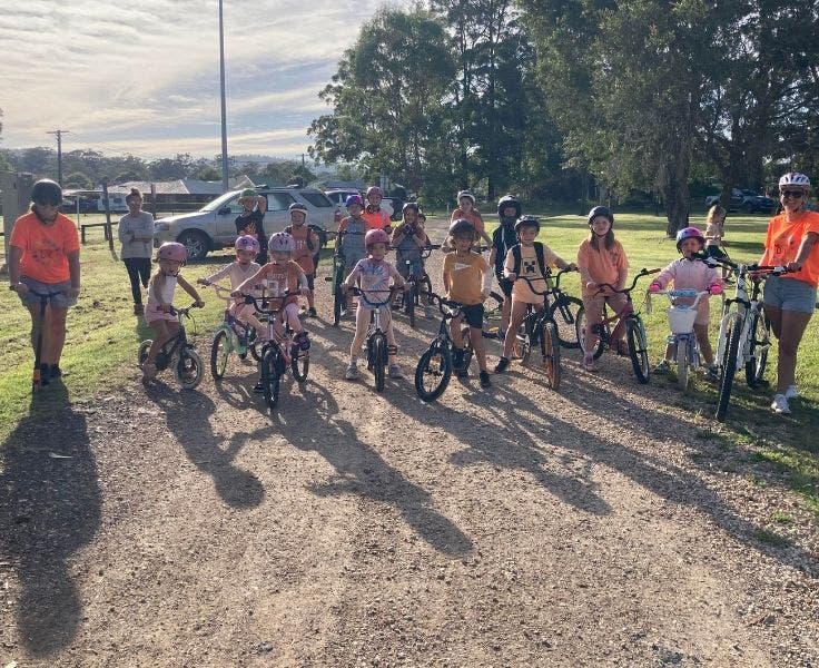 a bunch of students on their bikes