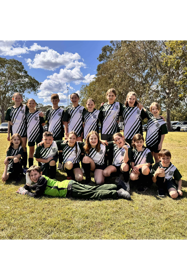 Student soccer team posing for a team photo